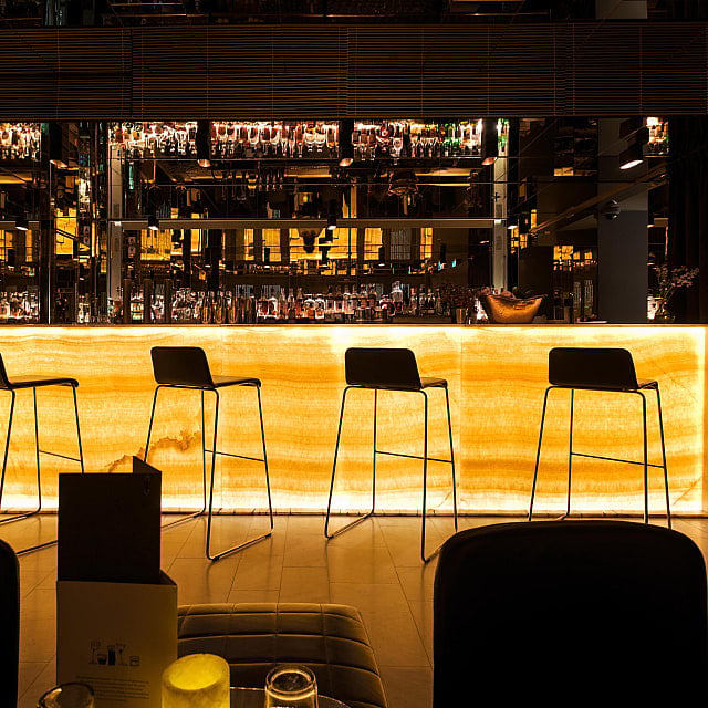 Dark modern bar with warm amber light
